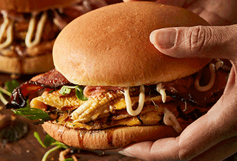 Egg Foo Yong and Sriracha Bacon Breakfast Burger on Milk Bun - Tip Top Foodservice