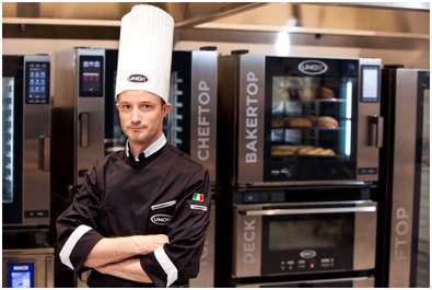UNOX Chef infront of ovens